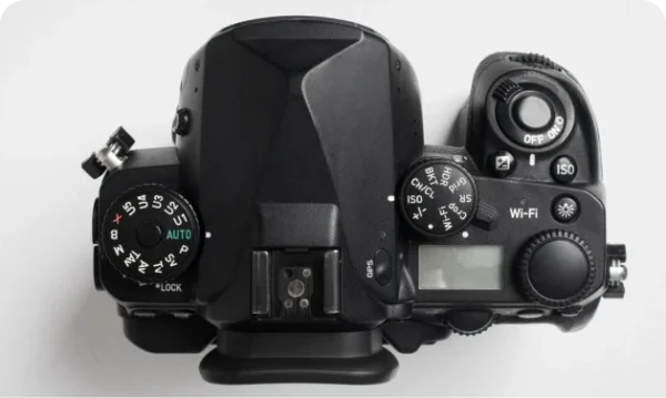 Hand holding photo camera
