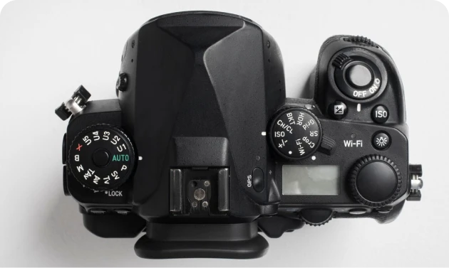 Hand holding photo camera