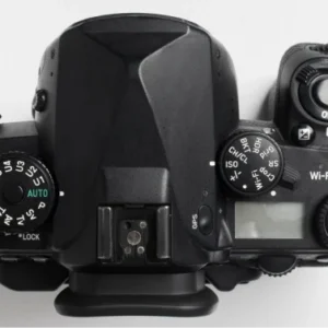 Hand holding photo camera