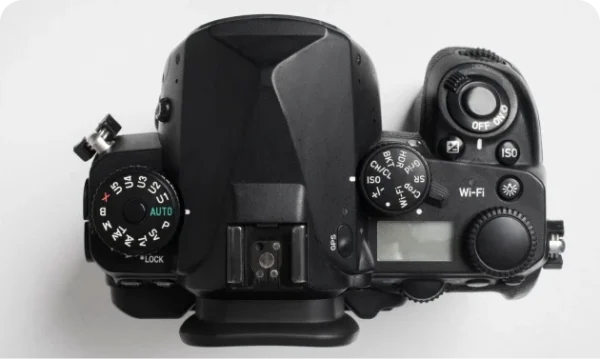 Hand holding photo camera